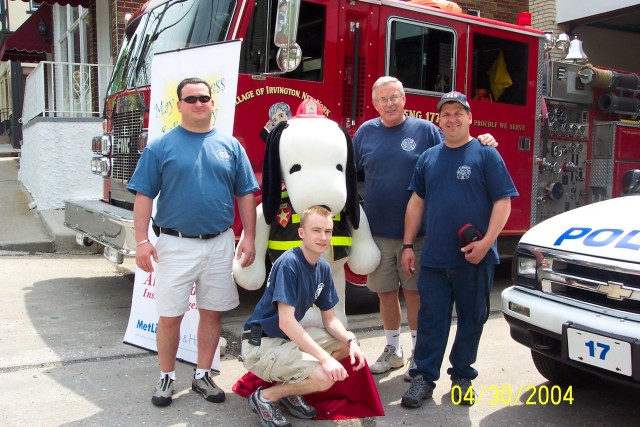 2nd Asst. Chief Mastropietro, Lt. Dowd, Fire Prevention Capt. Costello, and Chief Ruffler with F/F Snoopy, IFD Open House, April 2004.